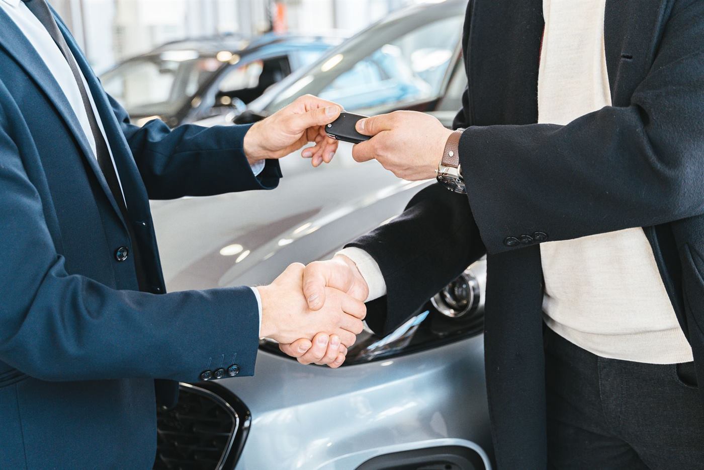 Handing over the car keys after a confirmed booking